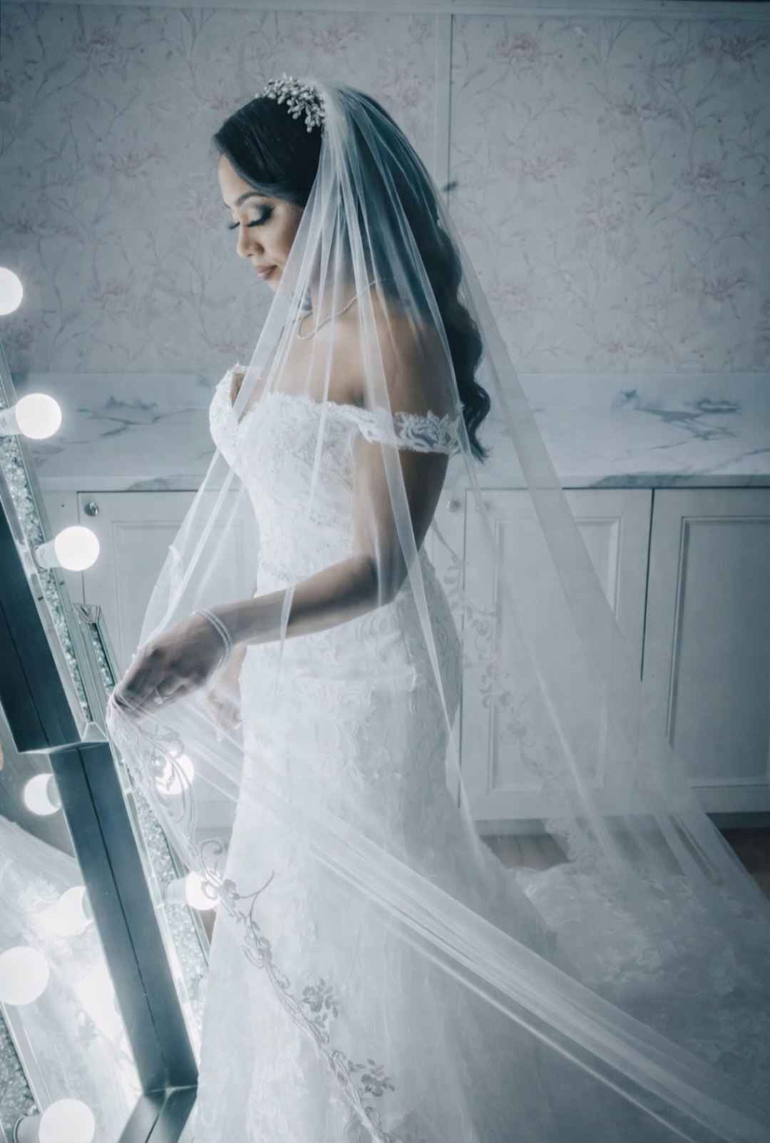 Off-shoulder lace gown with cathedral veil
