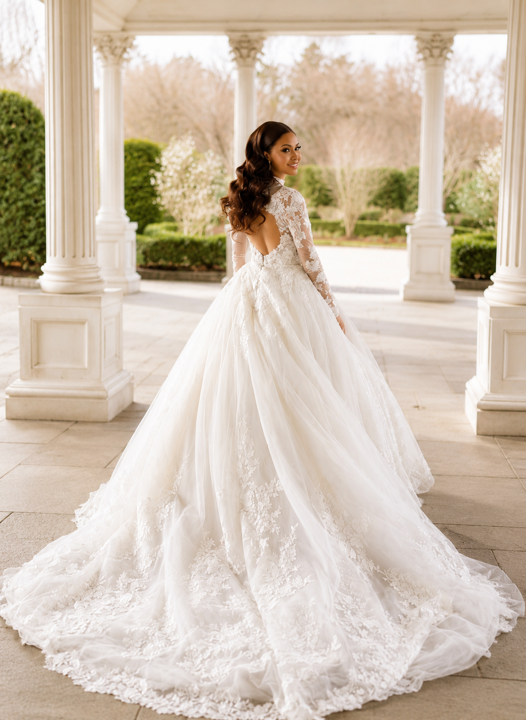 Long-sleeve lace ballgown at garden portico